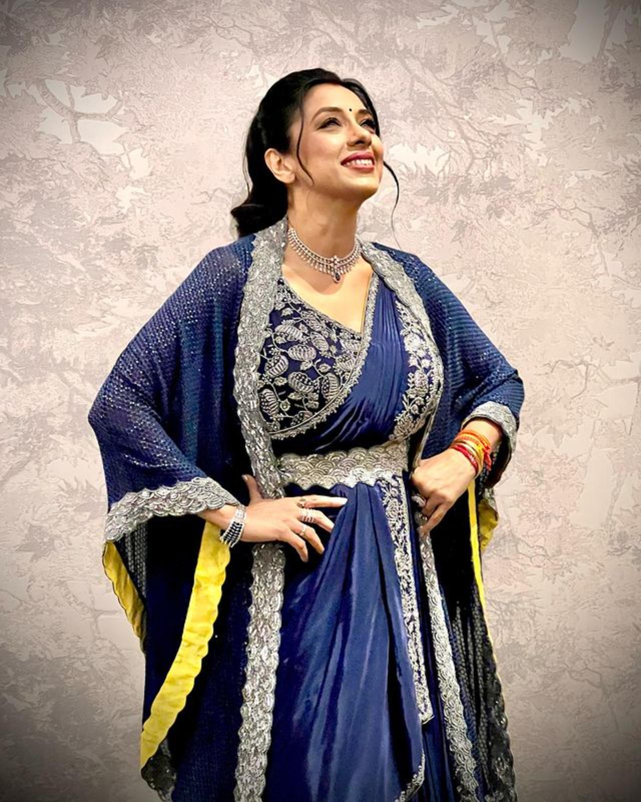 This royal blue saree with a sparkling border and a diamond-studded blouse paired with a kaftan-like jacket is a winner
 